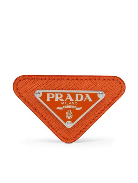 prada triangular logo pin